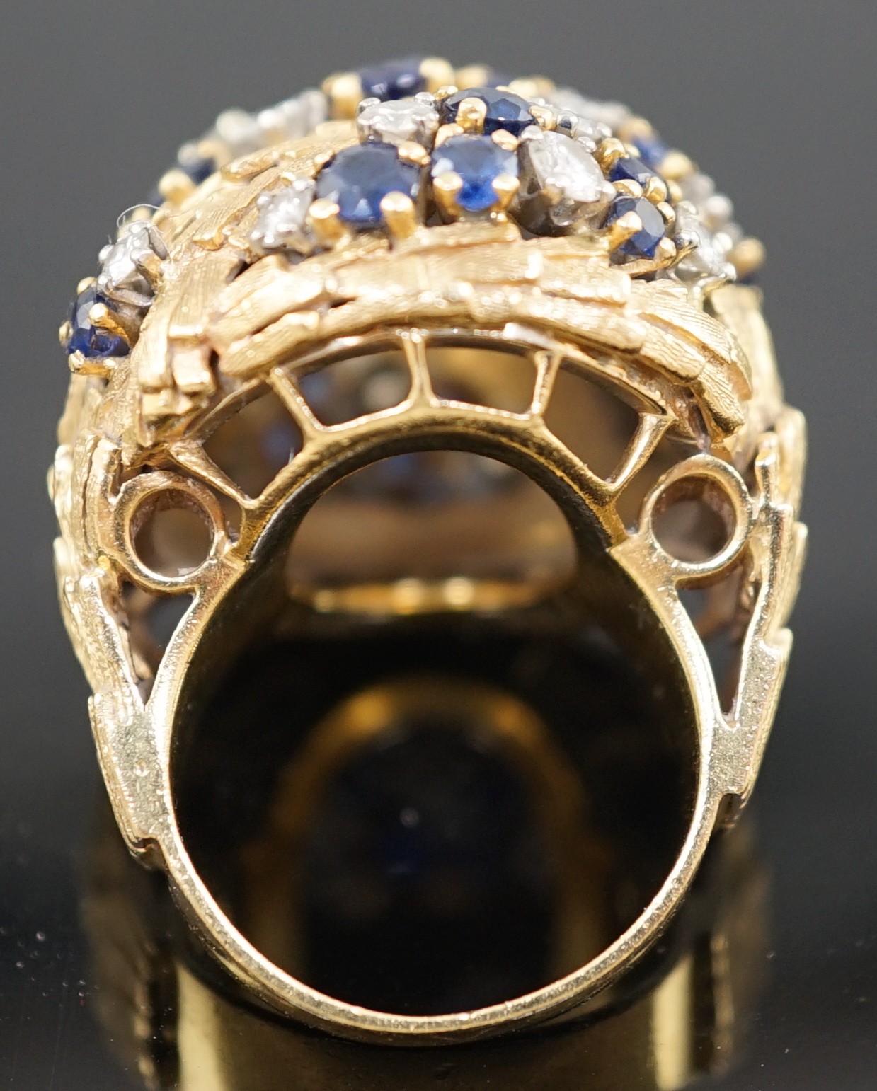 A mid 20th century textured 18ct gold, sapphire and diamond cluster set domed dress ring, by E. Meister, Zurich